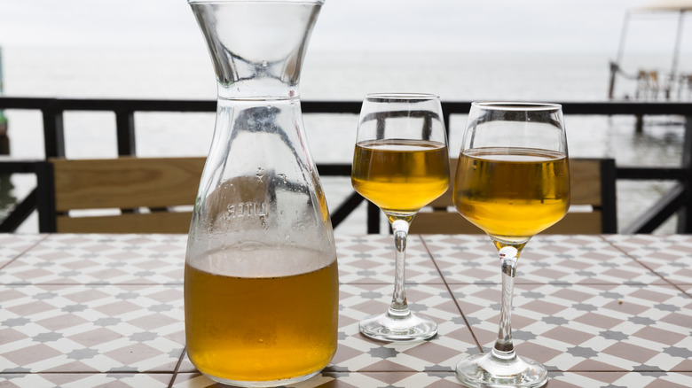 orange wine pitcher and glasses