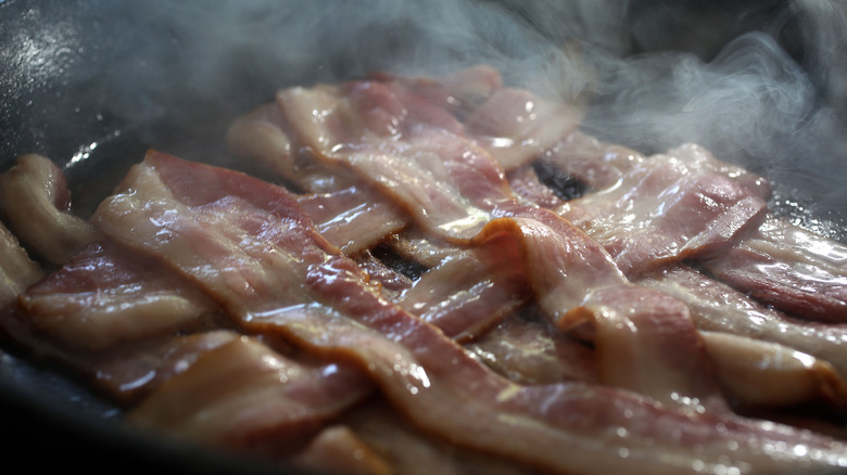 Bacon frying in a pan