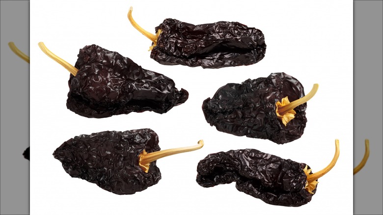 Ancho chiles on white background