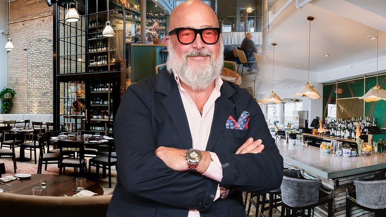 Andrew Zimmern with his arms crossed in front of images of restaurant dining rooms