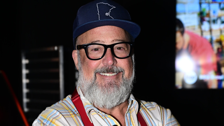 Andrew Zimmern press photo in Minnesota cap