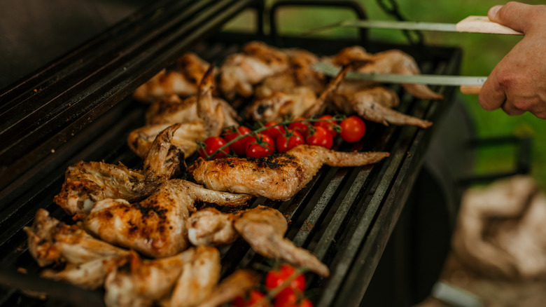 Cooking chicken over a grill