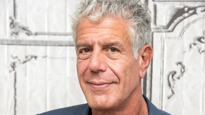 Close up of Anthony Bourdain on a white background.