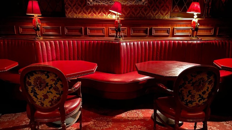 Red leather booths and tables at The Prince bar in Los Angeles