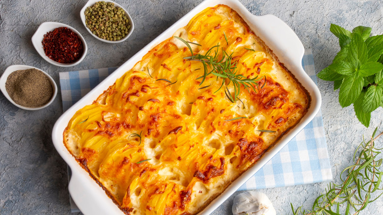 Top down photo of scalloped potatoes in a casserole baking dish