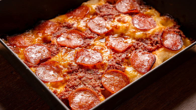 A Detroit-style pizza in a pan