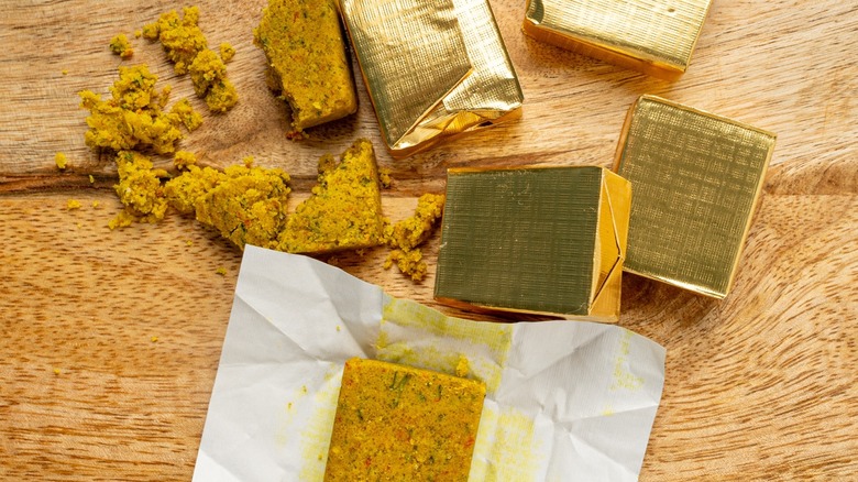 Close-up of bouillon cubes with gold foil