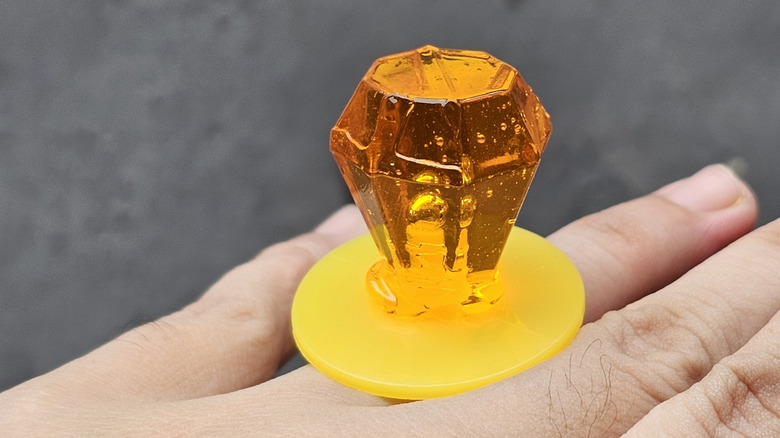 ring pop worn on a persons hand