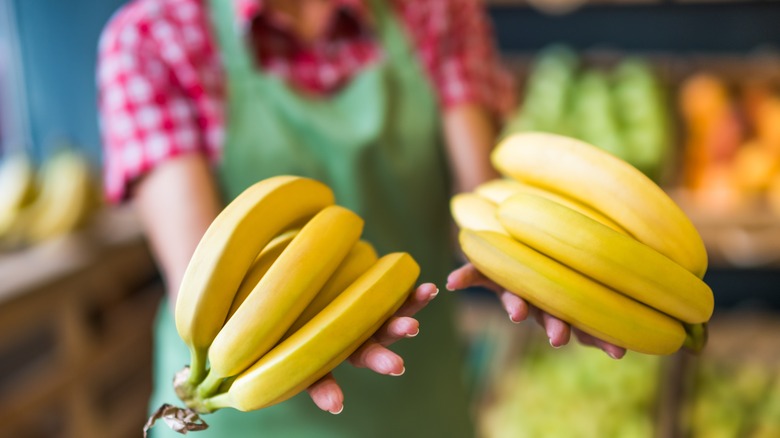 Bananas in woman's hands.