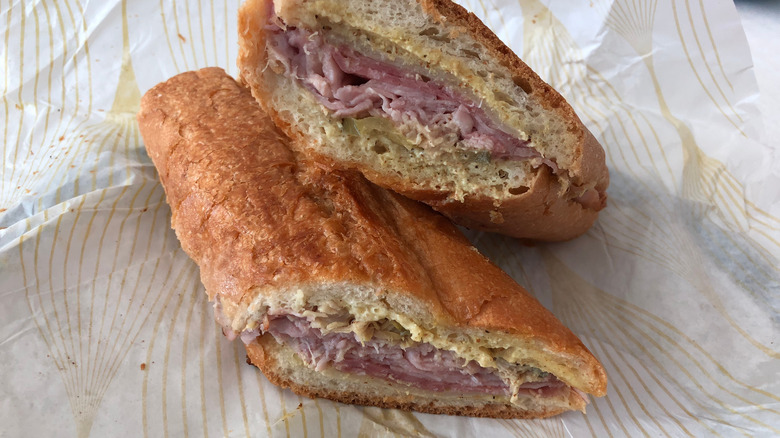 Two halves of a Tampa cuban sandwich stacked on each other.