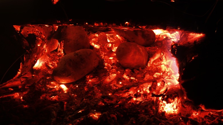 potatoes roasting in fire