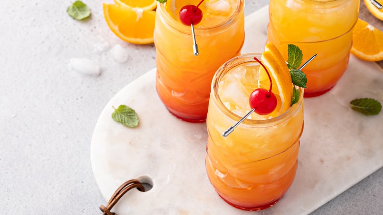 three glasses of hurricane cocktails