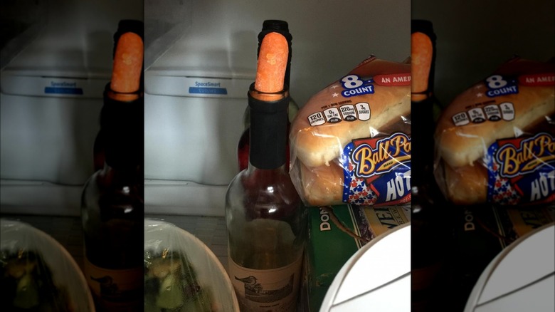 Baby carrot as wine stopper.