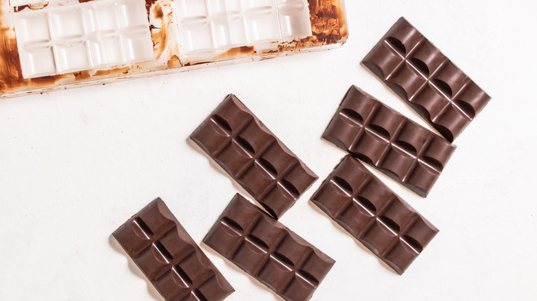 Chocolate bars next to a chocolate mold