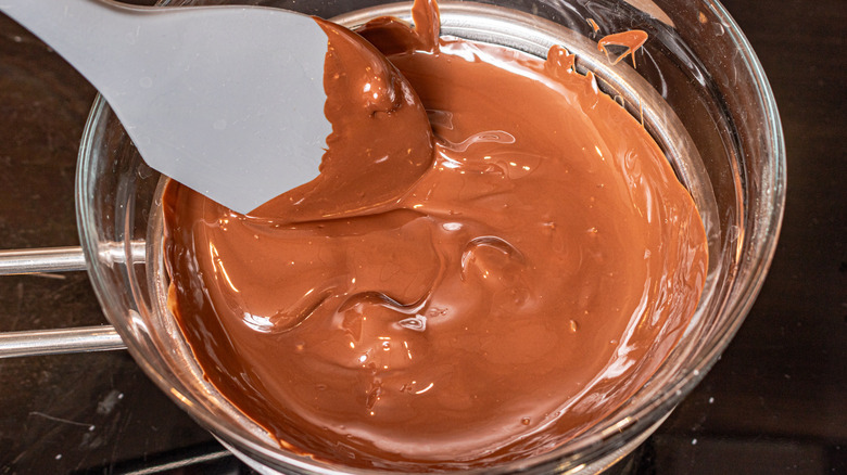 Melting chocolate in a bowl over hot water