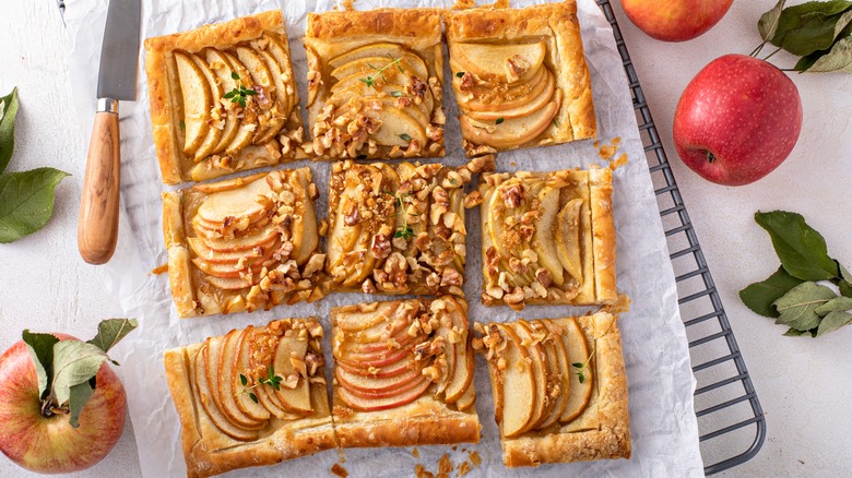 Sliced apple tart cooling on a wire rack