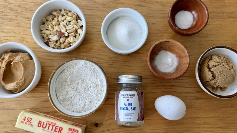 Ingredients for peanut butter cookies on a wood table