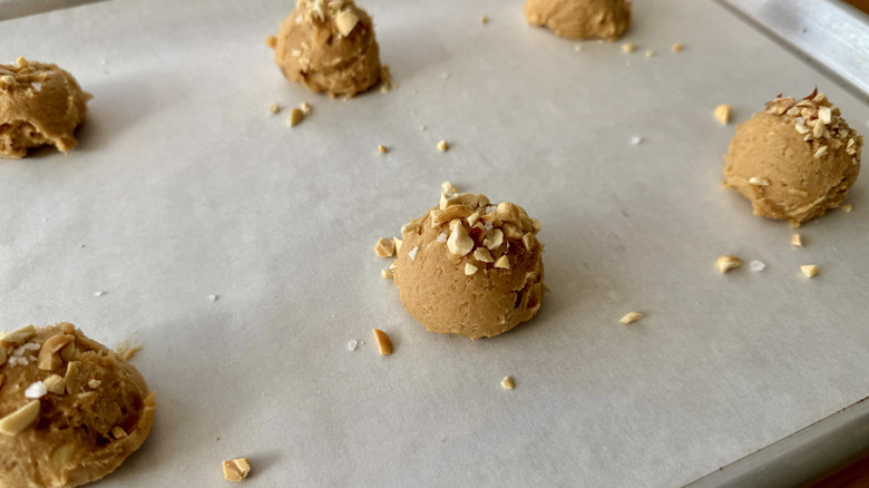 Peanut butter cookie dough balls on parchment paper