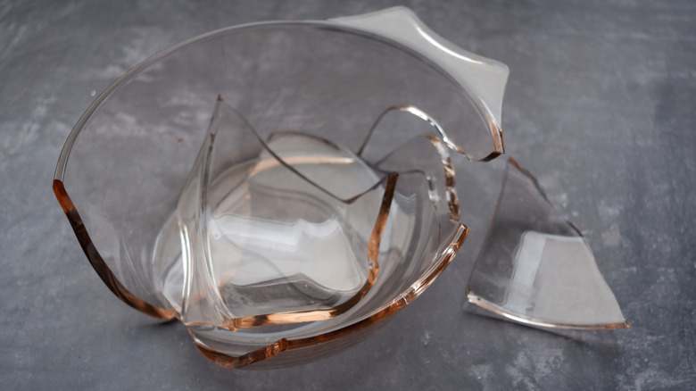 A broken Pyrex dish on a counter surface.