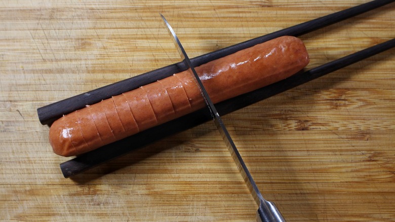slicing hot dog