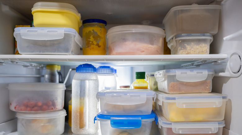 Lots of Plastic Food Containers in Fridge