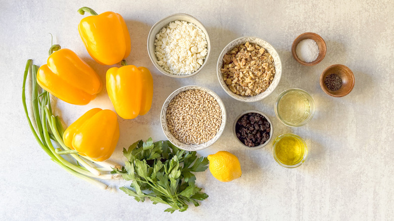 Barley and walnut-stuffed bell peppers ingredients on countertop