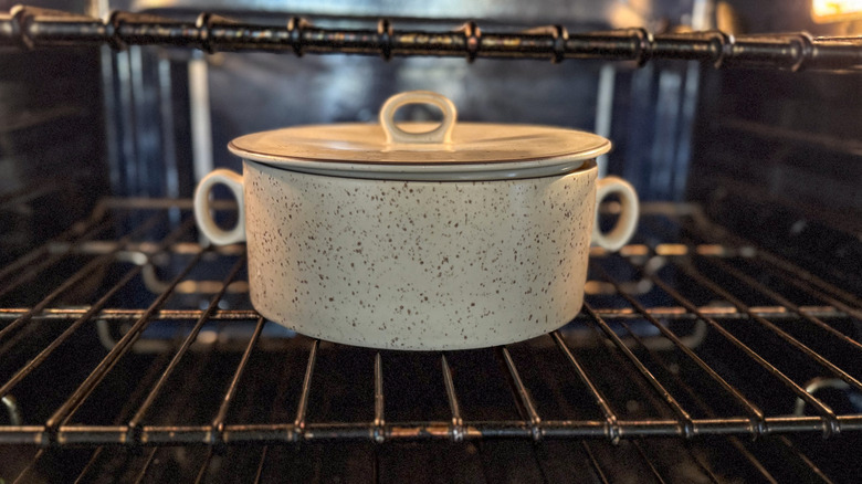 Covered casserole dish in oven