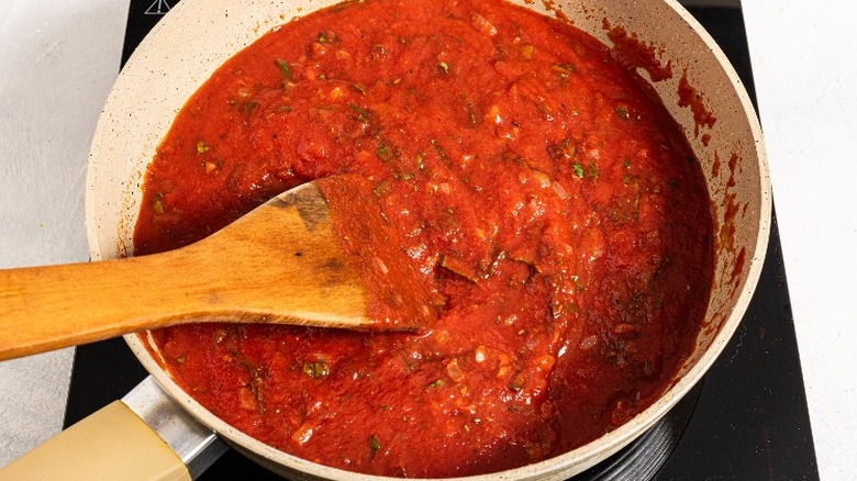 Basic all-purpose tomato sauce in a skillet with a spatula