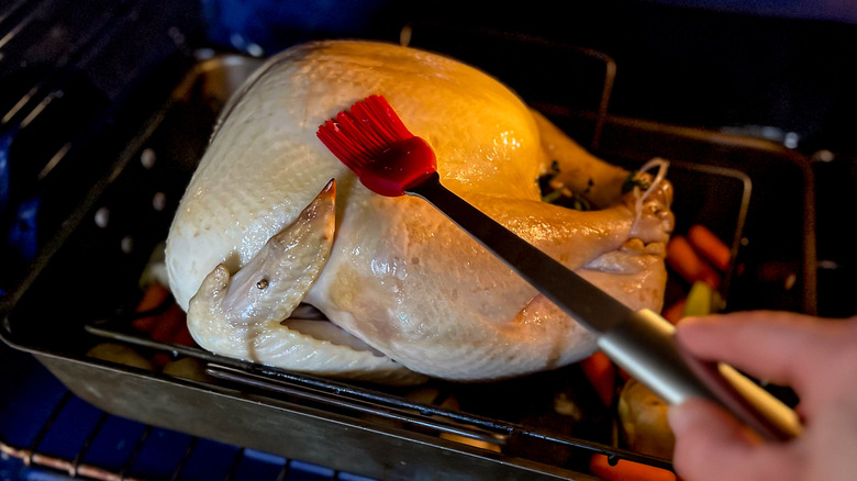 Basting turkey in oven