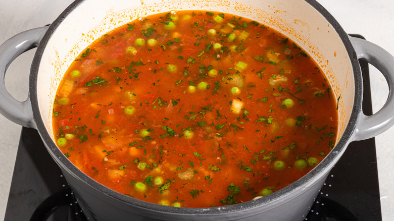 Soup pot with tomato and herb vegetable soup