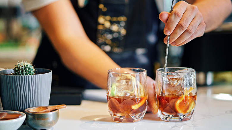 Bartender mixing drinks