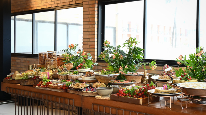 Pretty buffet spread interspersed with fresh flowers