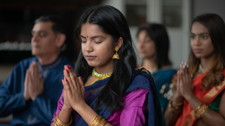 A Hindu woman praying