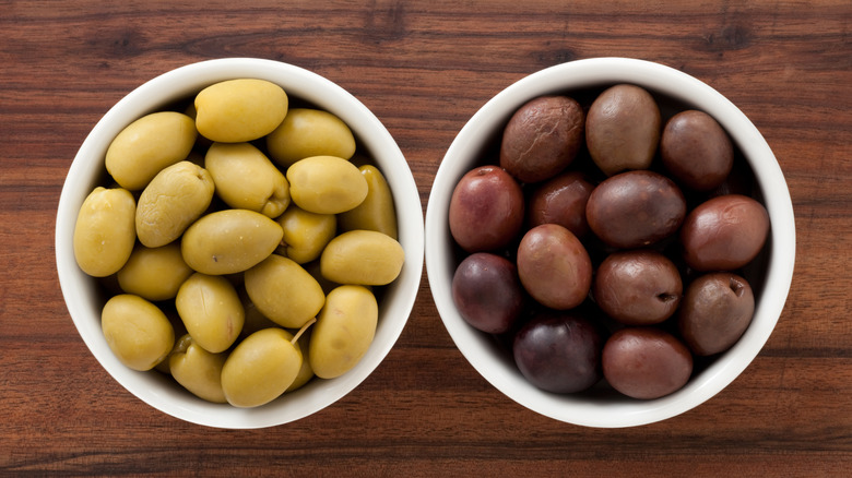 Bowls of green and black olives