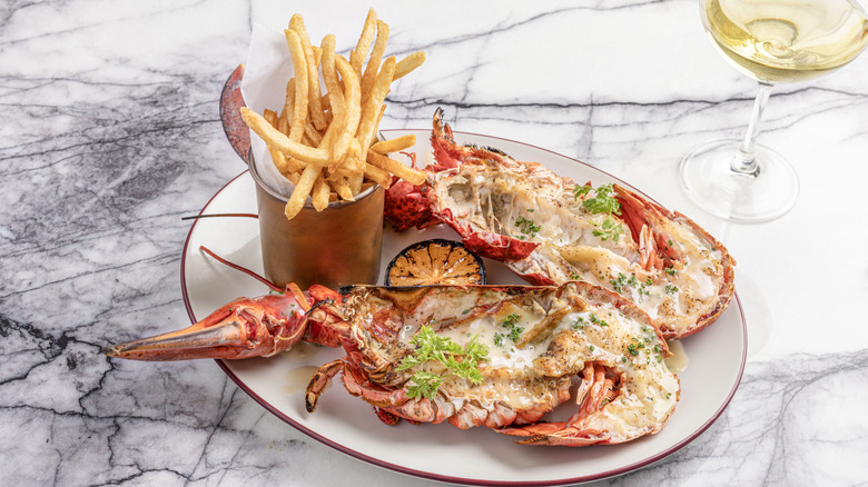 Split lobster with fries, wine