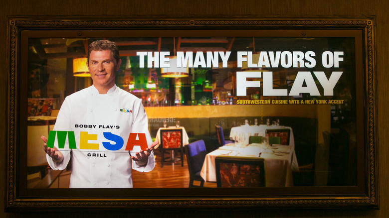 A billboard advertisement for Mesa Grill featuring Bobby Flay.