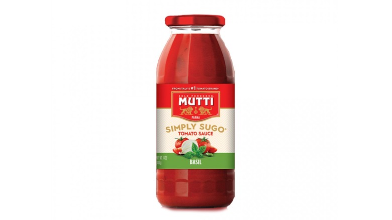 Jar of Mutti Simply Sugo Basil Tomato Sauce on white background. 