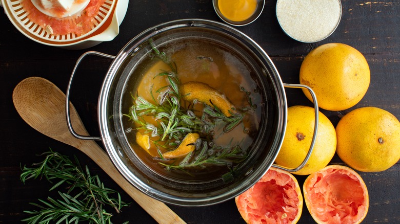 Double boiler of rosemary grapefruit infused syrup