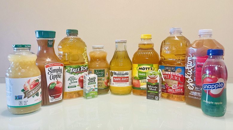 Assorted bottles of apple juice