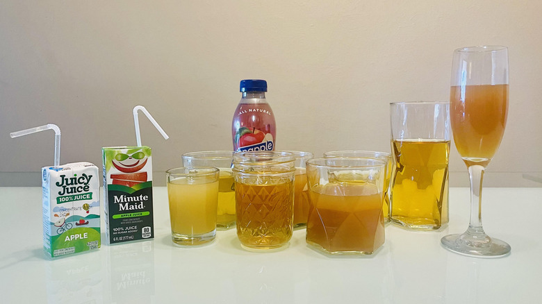 Glasses of various apple juices