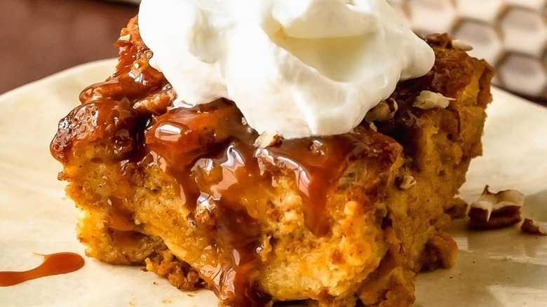 Pumpkin bread pudding with caramel and whipped cream