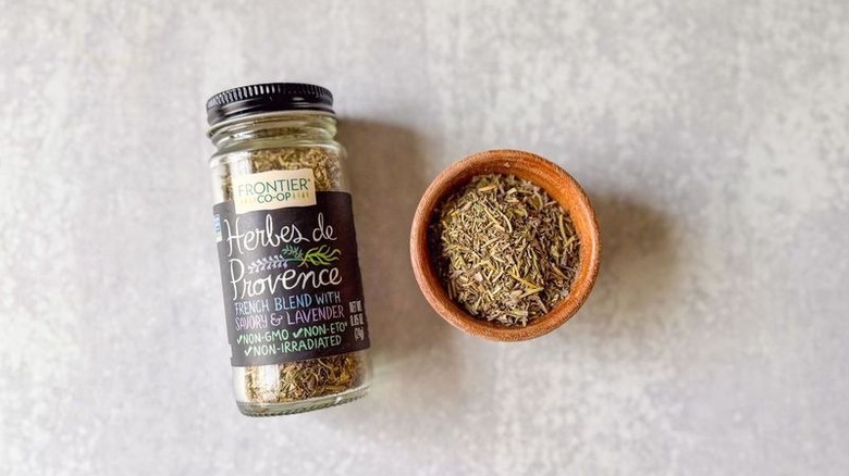 Herbes de Provence in jar and in wooden bowl