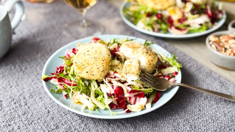 goat cheese salad with goat cheese on fork