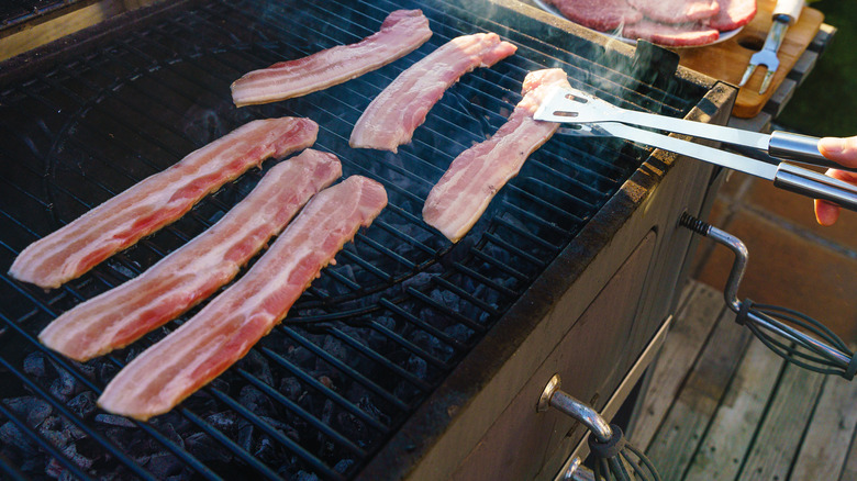 Person grilling bacon