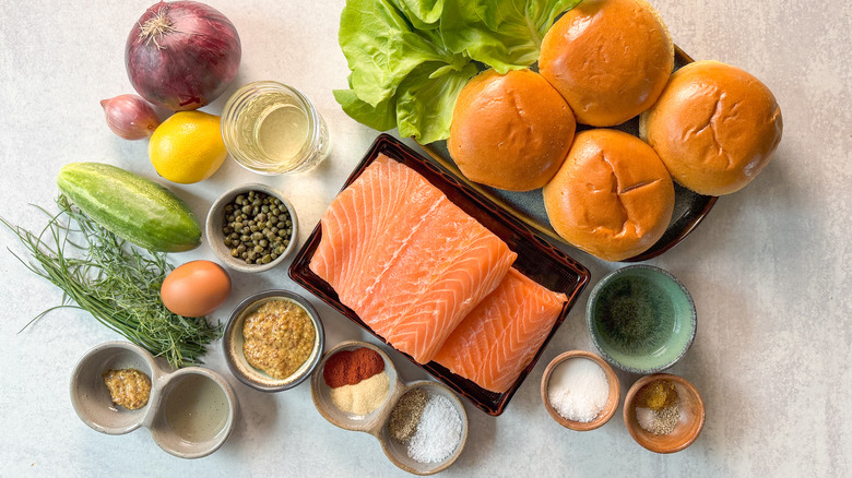 Broiled salmon burgers with curry remoulade ingredients on coutertop