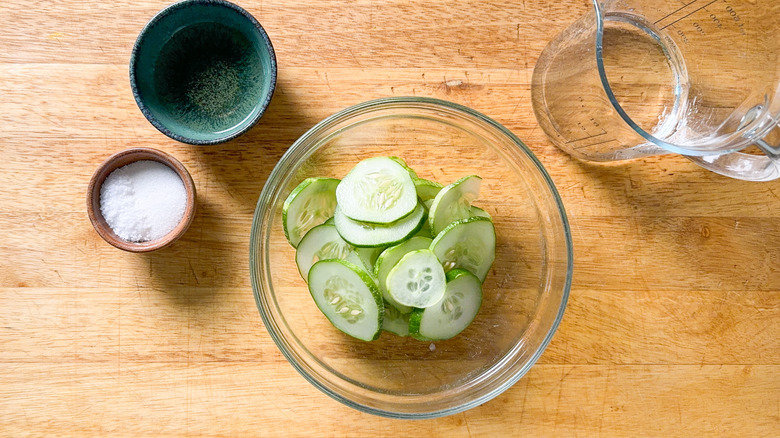 Quick pickled cucumber ingredients on cutting board