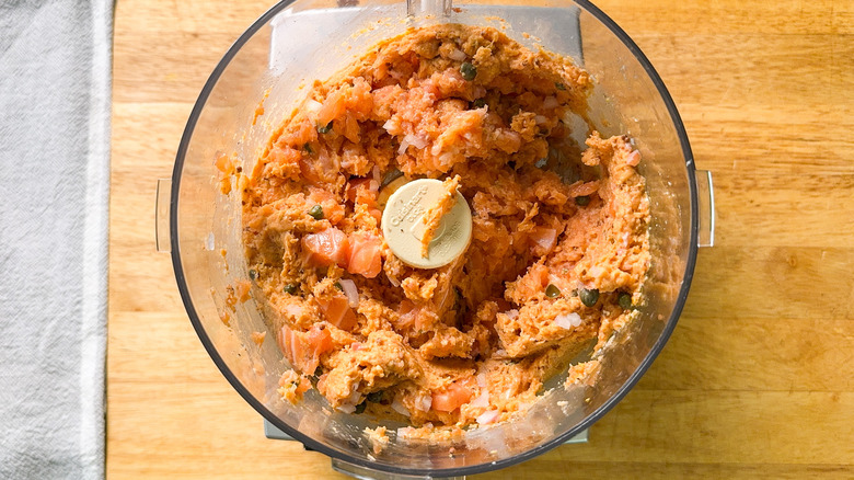 Pureed salmon filet, capers, shallots, and seasonings in food processor bowl