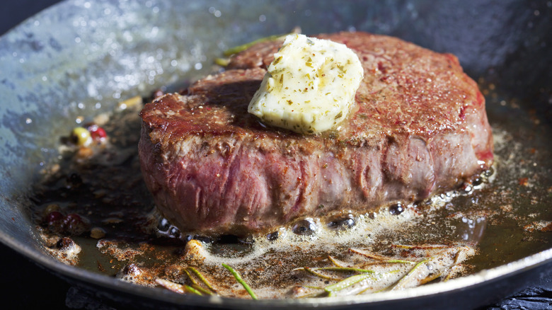 A steak with brown butter and herbs