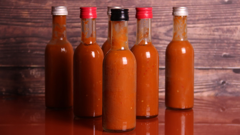 Six hot sauce bottles