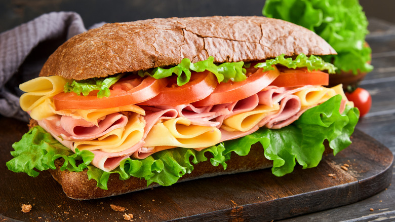 Loaded sandwich on wooden board